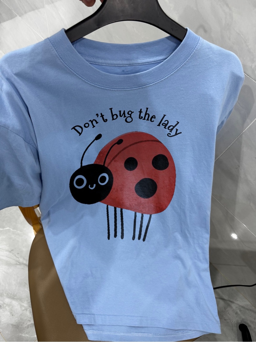 Gildan Light Blue Tee with Red and Black Ladybug Graphic